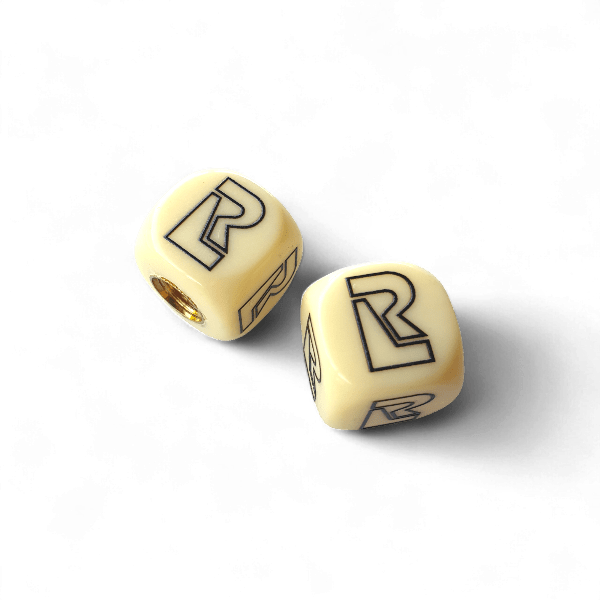 Redline - R Logo Dice Tire Valve Caps (Pair) - Bone White - old school bmx - Bmx Products AU